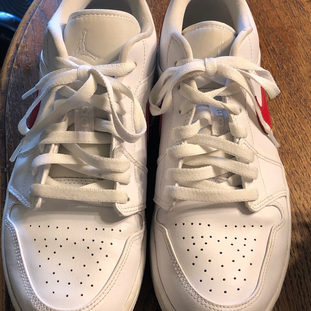 White women’s Nike Jordan Low-Top Sneakers with Red Accent